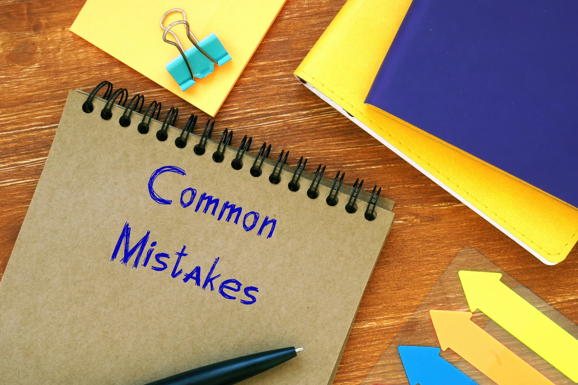A notebook that says common mistakes next to folders