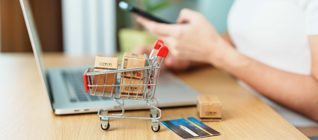A miniature shopping cart filled with small boxes | Wallach & Associates, P.C.